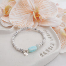 Load image into Gallery viewer, 925 Sterling Silver Howlite Peruvian Opal and aquamarine Handmade Crystal Bracelet on a jewellery dish with peach orchids - Proudly Supporting Sea Shepherd
