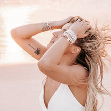 Load image into Gallery viewer, SUN BLOOM SS21 flower agate crystal bracelets worn on wrist rose gold silver beach blonde sunset
